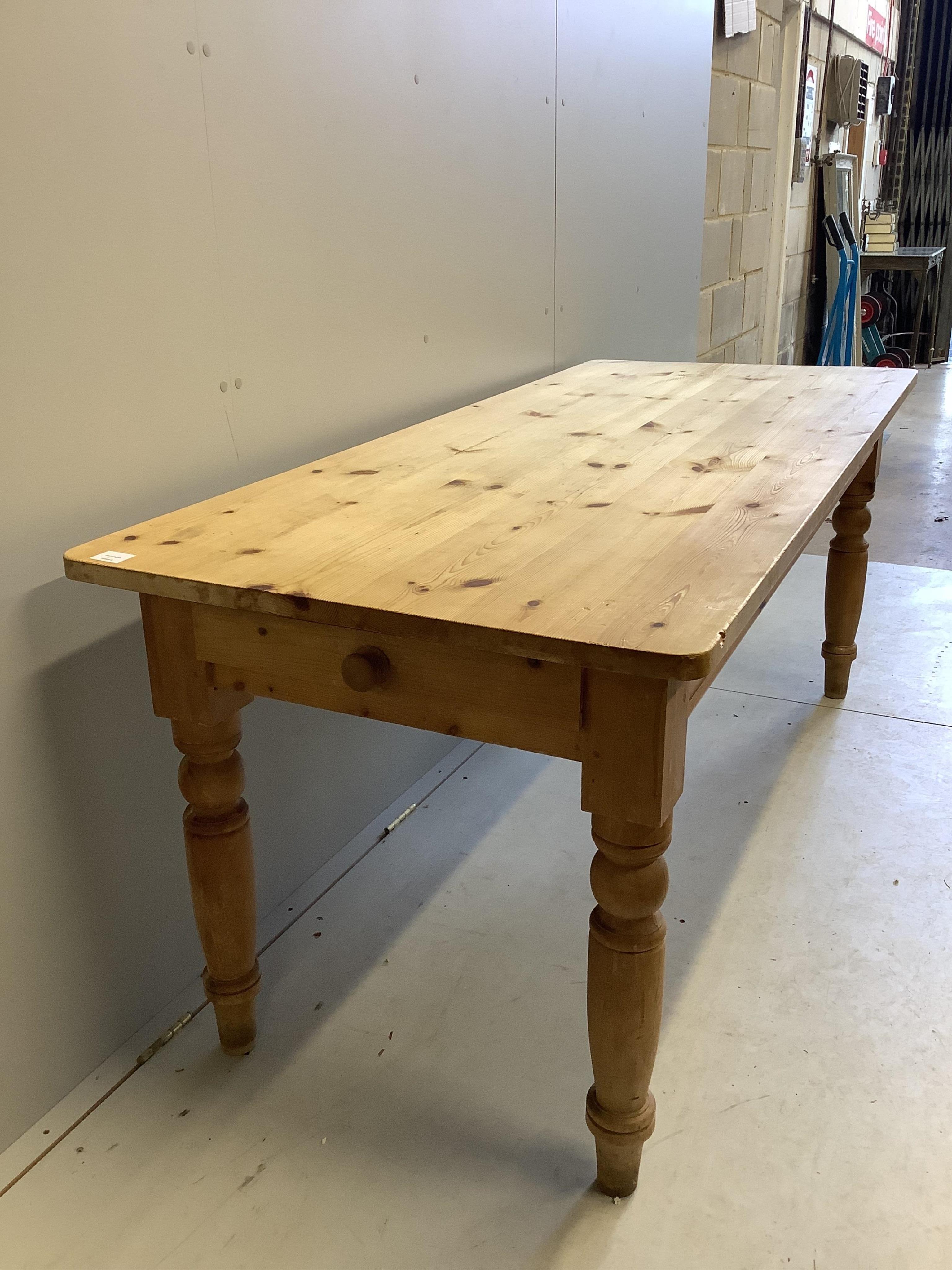 A Victorian style rectangular pine kitchen table, width 183cm, depth 76cm, height 76cm. Condition - fair to good